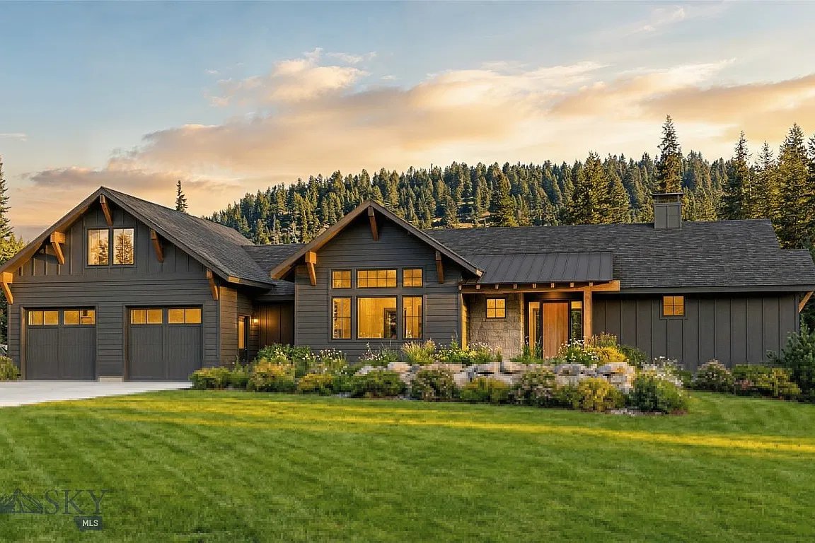 Exterior of 35 Low Dog Road at sunset with evergreens behind
